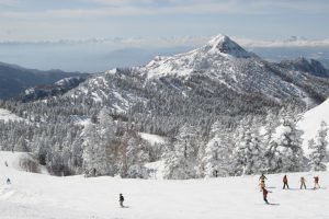 snowy mountains and skiers in Japan