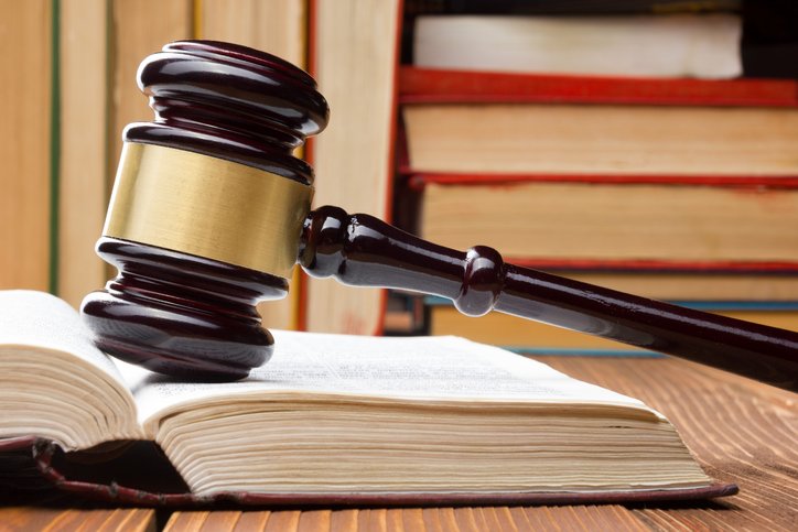 Law book with wooden gavel | Shine Lawyers