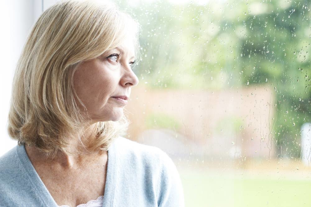 sad-woman-staring-out-window-thumb